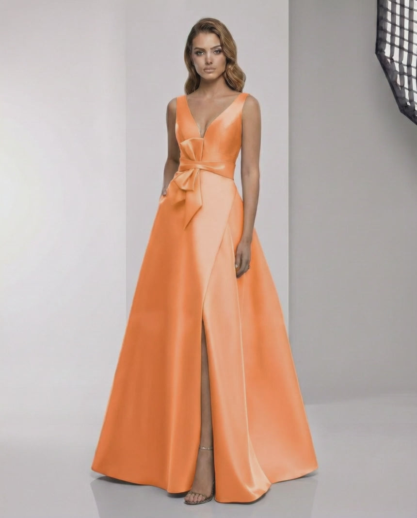 Solmira Maxi Dress in orange satin with wrap slit and bow waist, designed for elegant occasions by Lauven.