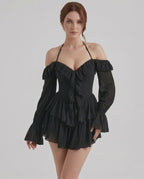 Ravelle Mini Dress by Lauven – Black halter ruffle mini dress with sheer sleeves and layered details.