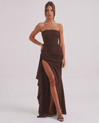 Solenne Maxi Dress featuring a strapless design, dramatic side slit, and luxurious brown fabric by Lauven.