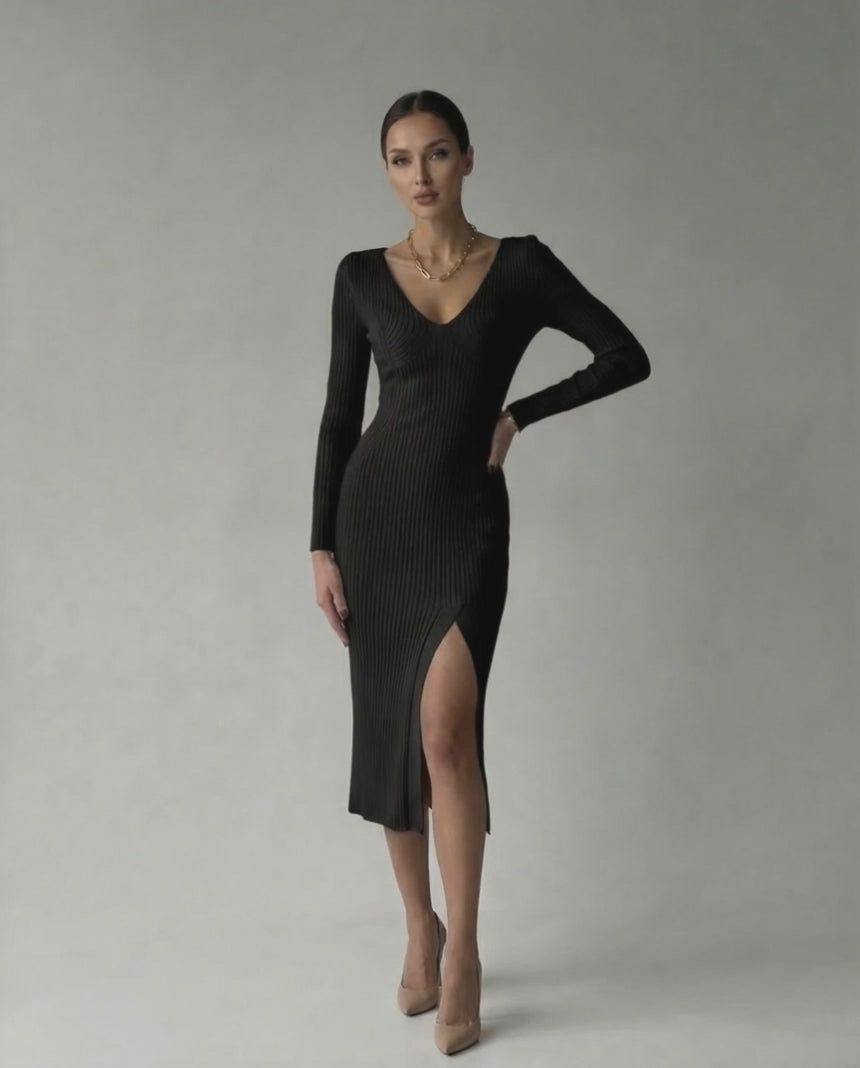 Model wearing the Lauven Luna Midi Dress, an elegant ribbed knit V-neck pencil dress in black.