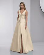 Calista Maxi Dress - elegant satin A-line with bow detail, V-neck, and stylish slit for a refined evening look.