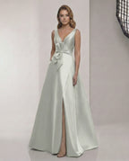 Virelle Maxi Dress - Satin sage silver A-Line gown with V-neck and bow detail, perfect for elegant occasions.