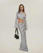 Nova Midi Dress by Lauven in elegant silver, featuring asymmetrical design and chic slash neckline.