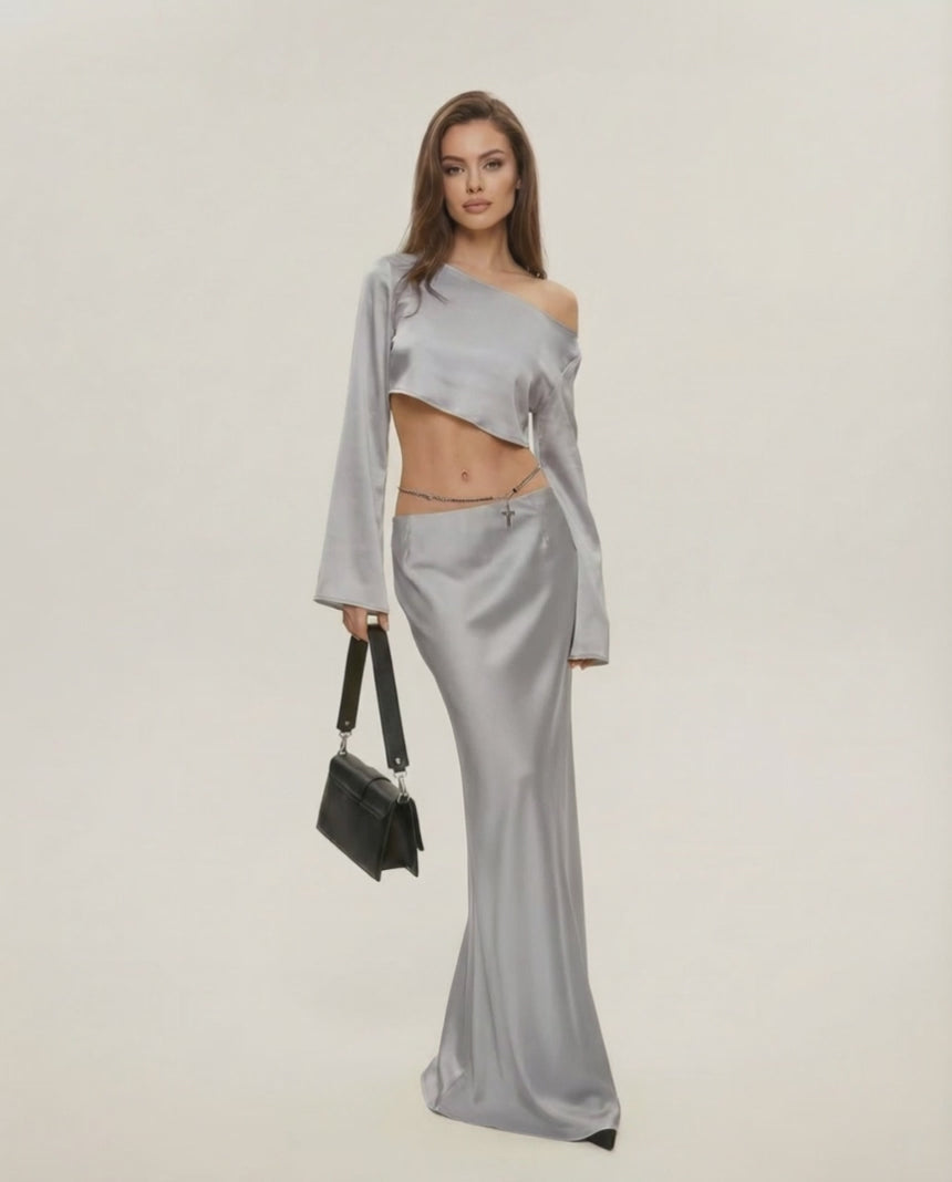 Nova Midi Dress by Lauven in elegant silver, featuring asymmetrical design and chic slash neckline.