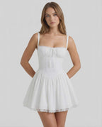 Elara Mini Dress - White corset style mini dress with lace trim from Lauven, combining softness with modern elegance.