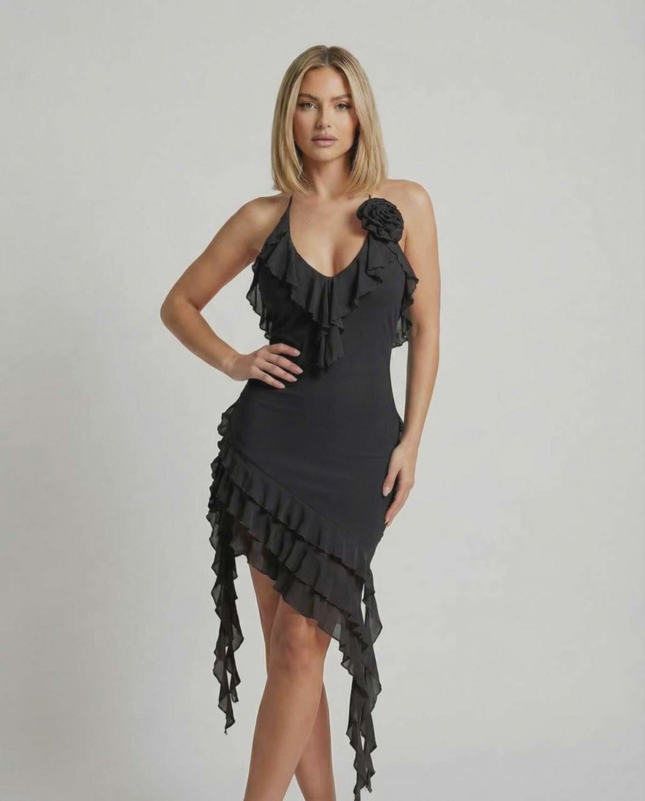 Noir Mini Dress by Lauven with ruffle detail and asymmetric hemline in classic black.
