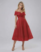 Seren Midi Dress by Lauven, a stunning off shoulder elegant red dress with a flowing midi skirt.