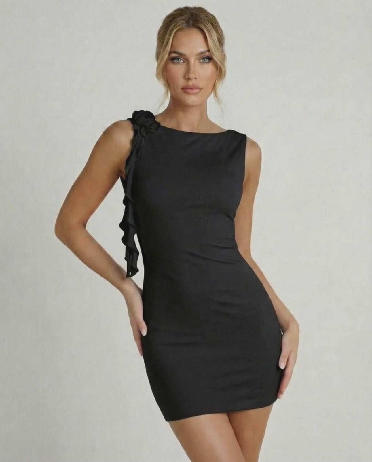 Noir Mini Dress by Lauven, sleeveless bodycon design with ruffle detail, perfect for stylish occasions.