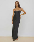 Calista Maxi Dress in black satin with floral embroidery, designed by Lauven for an elegant, fluid silhouette.