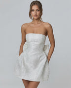 Ivory Mini Dress by Lauven, featuring a strapless neckline, A-line silhouette and pockets for a stylish look.