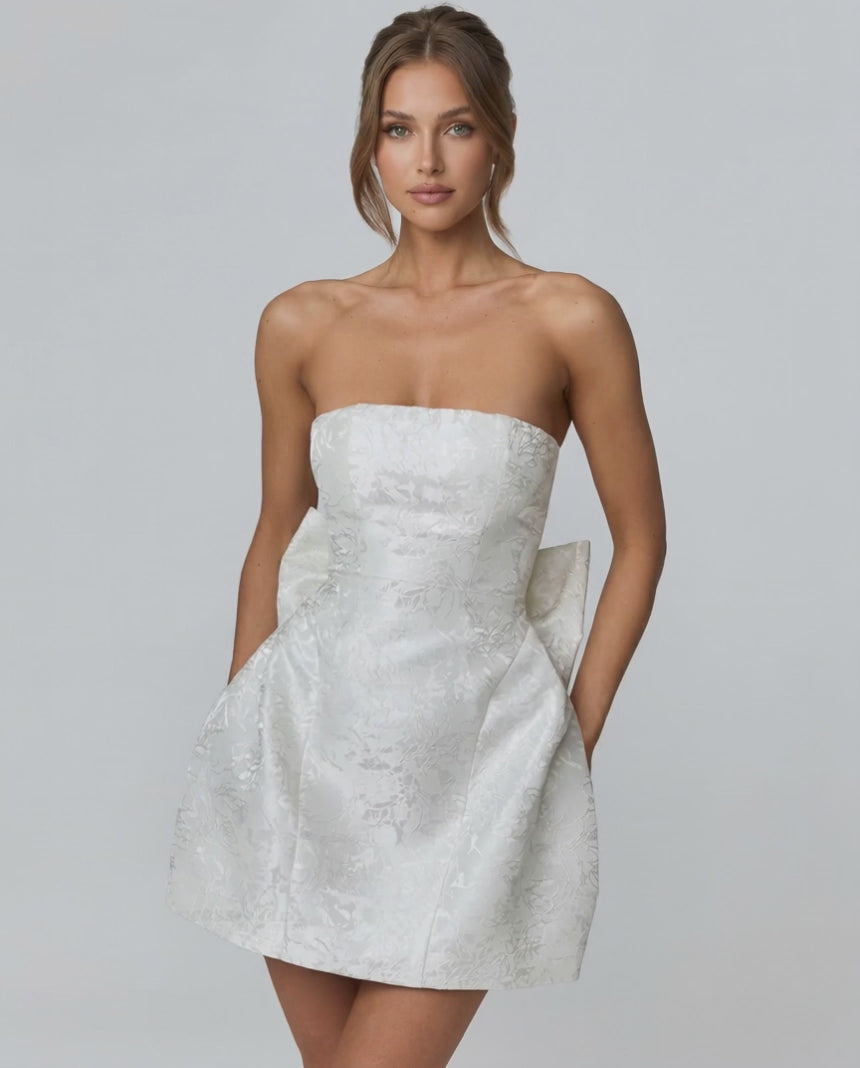 Ivory Mini Dress by Lauven, featuring a strapless neckline, A-line silhouette and pockets for a stylish look.