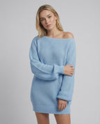Celeste Mini Dress by Lauven in light blue, featuring oversized knitted design and elegant off-shoulder neckline.