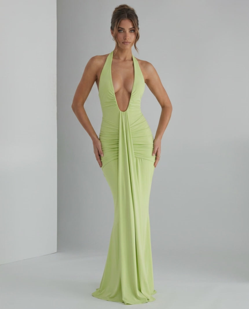 Aurelia Maxi Dress in light green, featuring a halter neck and smooth stretch jersey fabric for a sleek silhouette.