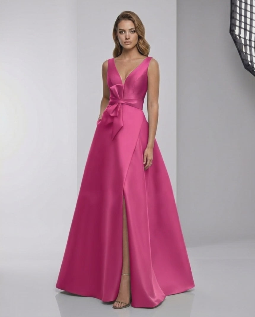 Calyptra Maxi Dress in fuchsia satin features a V-neck and A-line silhouette by Lauven, delivering elegance and modern style.