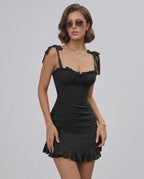 Raven Mini Dress by Lauven in Classic Black with Ruffle Details, featuring adjustable spaghetti straps.