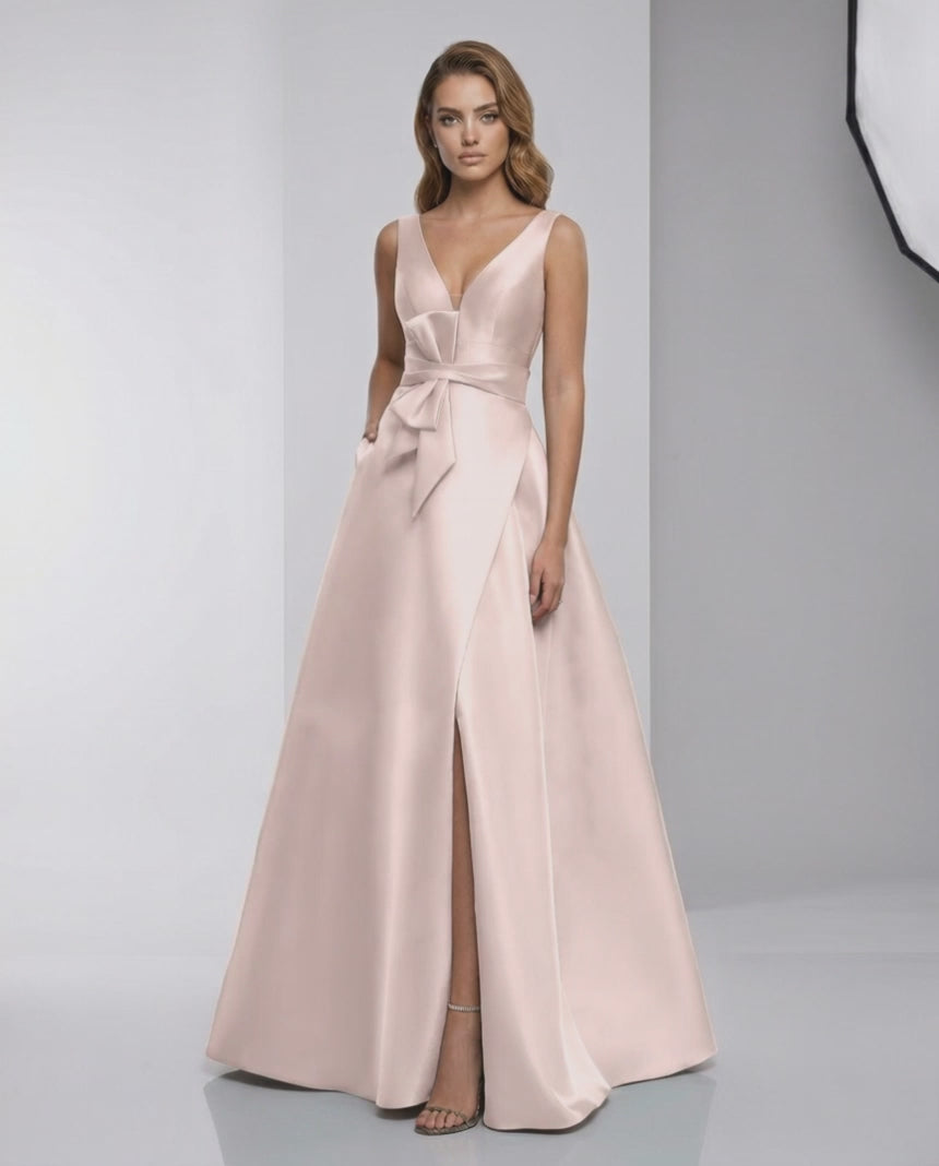 Zafira Maxi Dress - Blush Satin A-Line V-Neck with bow detail by Lauven, exuding elegance and modern style.
