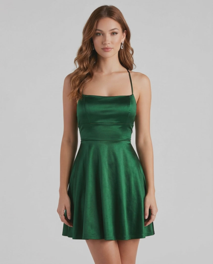 Emerald Satin Mini by Lauven – Elegant green A-line mini dress with spaghetti straps and satin finish.