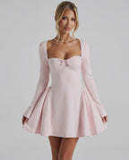 Elvire Mini Dress featuring elegant long sleeves, flattering fit, ruched neckline in soft pink by Lauven.