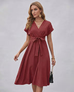 Serene Midi Dress in rich burgundy with pleated fabric, V-neck, self-tie belt by Lauven for a stylish and refined look.