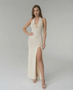 Sienna Maxi Dress - Cream halter dress with floral details and high slit by Lauven, perfect for modern occasions.