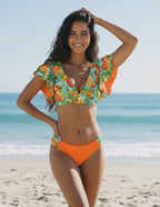 Lauven Citrus Two-Piece Swimsuit featuring orange tropical floral print and deep V-neckline, perfect for beach days.