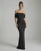 Noir Maxi Dress by Lauven — Elegant off-shoulder silhouette in classic black, showcasing sleek and smooth fabric.