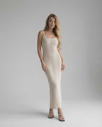 Elara Midi Dress - elegant sleeveless white bodycon dress by Lauven, showcasing a sleek modern look for day-to-evening wear.