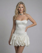 Ivory Mini Dress by Lauven - Strapless bodycon design with backless detail and playful ruffle hem.