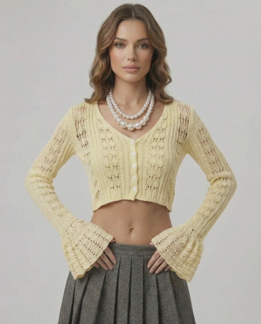 Solene Cardigan in soft yellow with a cropped silhouette, openwork knit, V-neck, by Lauven for a fresh wardrobe update.