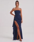 Solenne Maxi Dress by Lauven, features strapless bandeau design, high waist, dramatic side slit, and fluid polyester fabric.