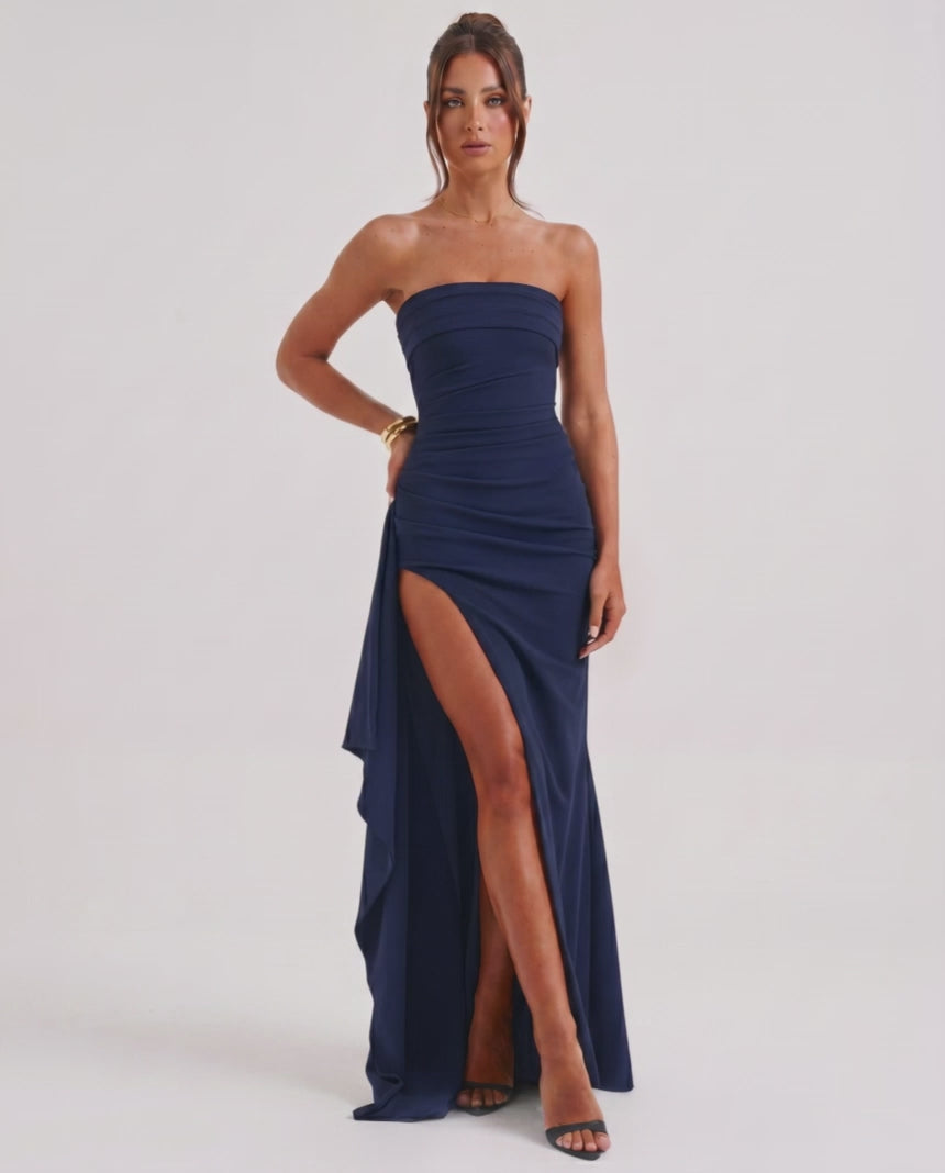 Solenne Maxi Dress by Lauven, features strapless bandeau design, high waist, dramatic side slit, and fluid polyester fabric.