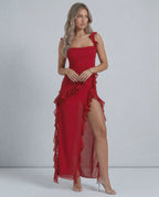 Lauven Carmine Maxi Dress featuring sheer fabric, ruffled shoulder straps, and an asymmetric hemline.
