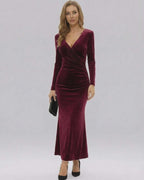 Celeste Maxi Dress by Lauven, showcasing a luxurious burgundy velvet design with long sleeves and a slim-fit silhouette.