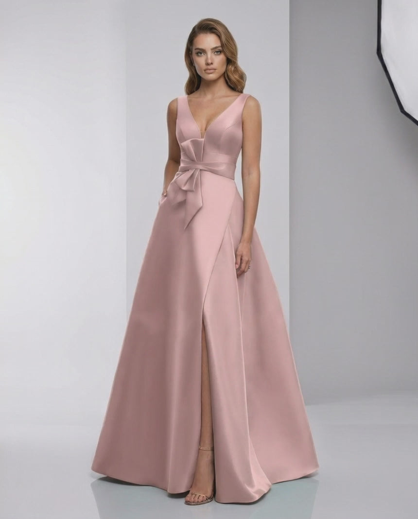 Roselle Maxi Dress in pink satin with A-line silhouette, V-neck, and elegant bow detail by Lauven.
