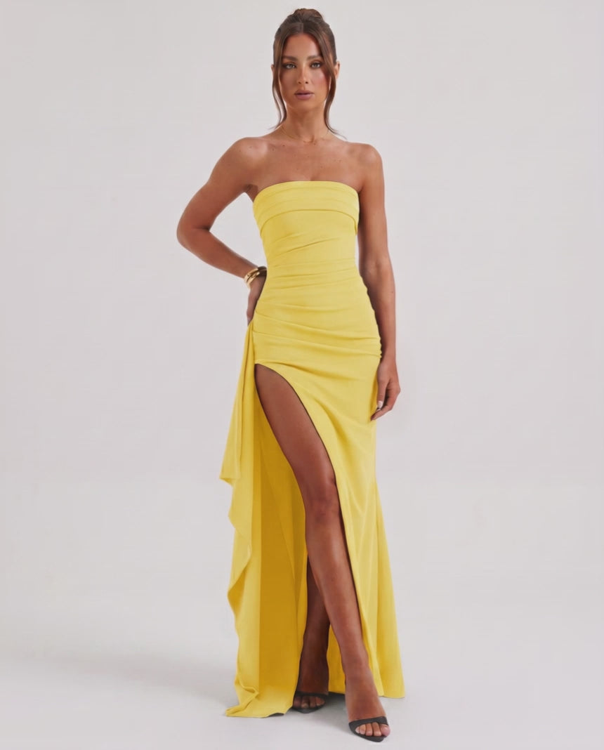 Solenne Maxi Dress in yellow, strapless design, dramatic side slit, by Lauven, elegant and modern look.