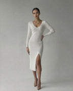 Elara Midi Dress by Lauven, elegant ribbed knit V-neck pencil dress in white with a thigh slit.