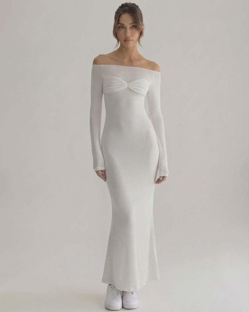 Luna Maxi Dress featuring an elegant off-shoulder neckline, full sleeves, and a smooth white silhouette by Lauven.