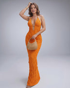 Lunara Maxi Dress in vibrant orange, textured polyester blend with halter V-neck, perfect for warm weather by Lauven.