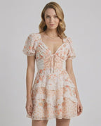 Coral Mini Dress by Lauven, featuring soft floral print, tiered ruffles, and a flattering A-line silhouette, perfect for a romantic look.