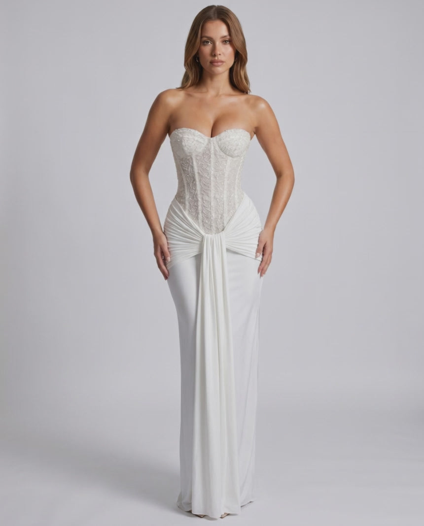 Serelisse Maxi Dress showcasing an off-the-shoulder design, structured corset bodice, and fluid skirt by Lauven.