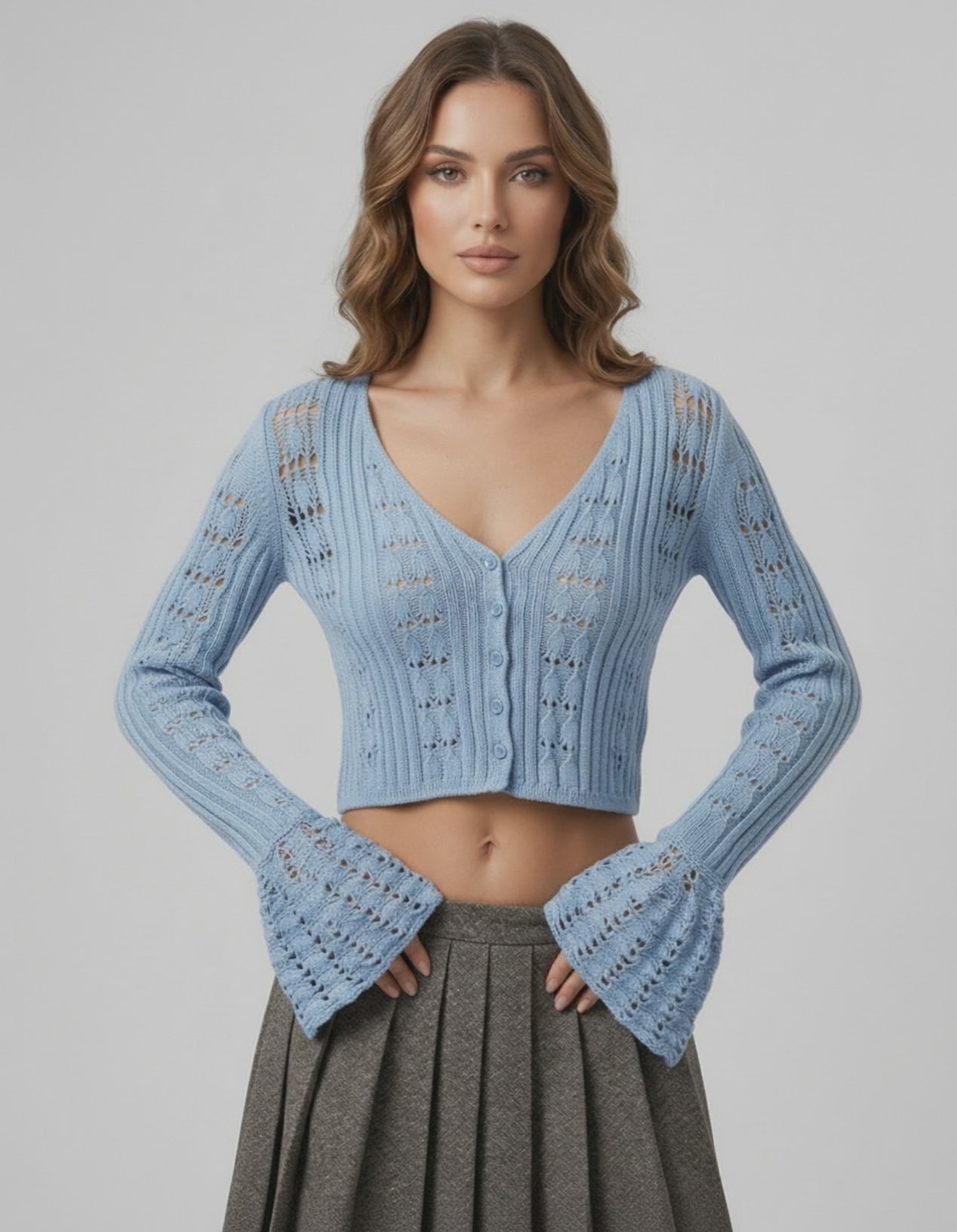 Oberon Cardigan Blue Cropped Sweater with openwork knit texture by Lauven, perfect for versatile seasonal styling.