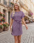 Elara Mini Dress in soft purple, featuring smooth woven fabric, round neckline, tied waist belt, by Lauven.