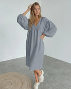Orion Midi Dress in gray cotton, featuring puff sleeves and a v-neck design for a modern, minimalist look by Lauven.