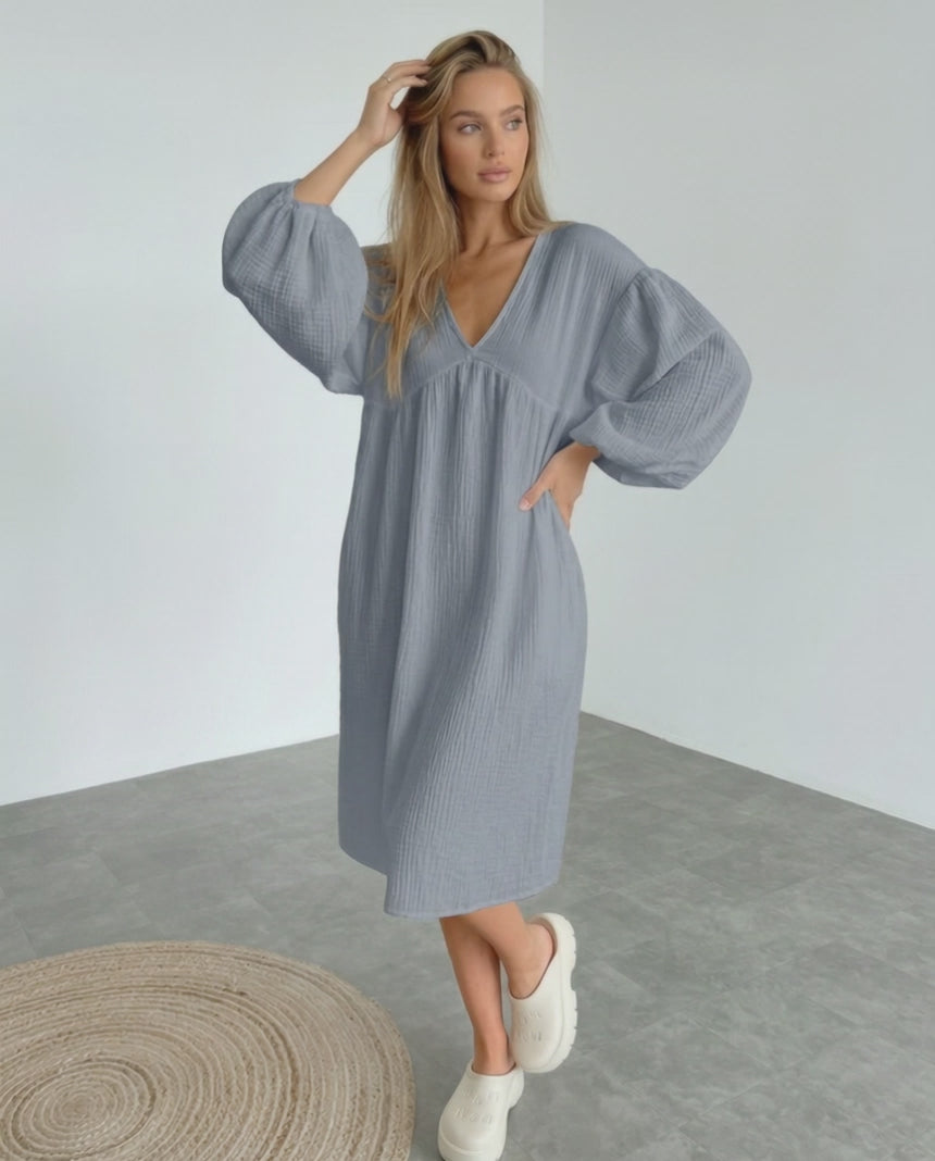 Orion Midi Dress in gray cotton, featuring puff sleeves and a v-neck design for a modern, minimalist look by Lauven.