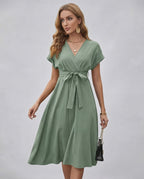 Serene Midi Dress in green, featuring pleated fabric, V-neck, A-line silhouette, and adjustable self-tie belt from Lauven.