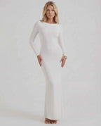 Lauven Celeste Maxi Dress in elegant white with long sleeves and open back, perfect for formal occasions.