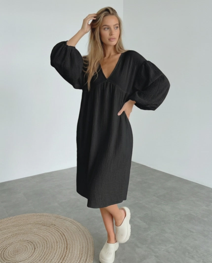Noir Midi Dress by Lauven, black cotton dress with puff sleeves, v neck, elegant and comfortable for modern style.