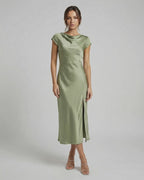 Virgo Midi Dress in soft sage green, featuring sleek satin fabric, twisted-back, and elegant cowl neck by Lauven.