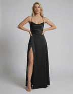 Lauven Monaco Maxi Dress showcasing a sleek black satin fabric with a high slit, perfect for elegant evening events.