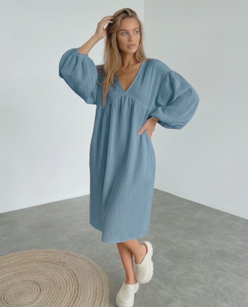 Aurelia Midi Dress in blue cotton, featuring puff sleeves and a flattering v neck, offering comfort and elegance by Lauven.